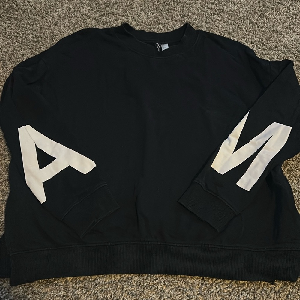 H&M black hoodie with letters, A and M on the arm